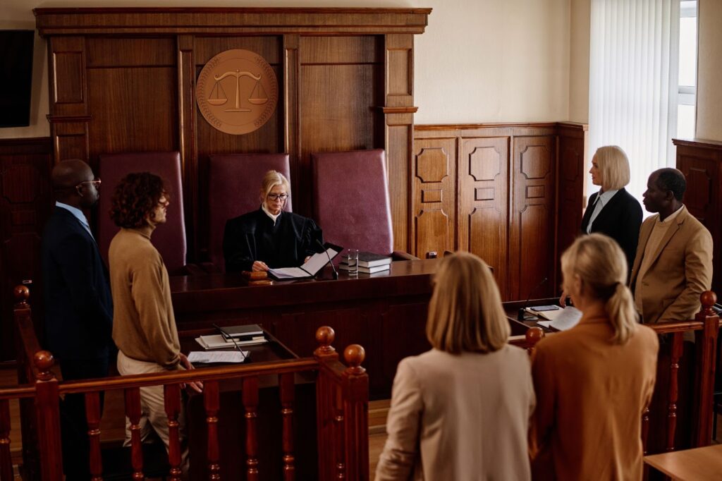 courtroom with judge, layers, and affiants