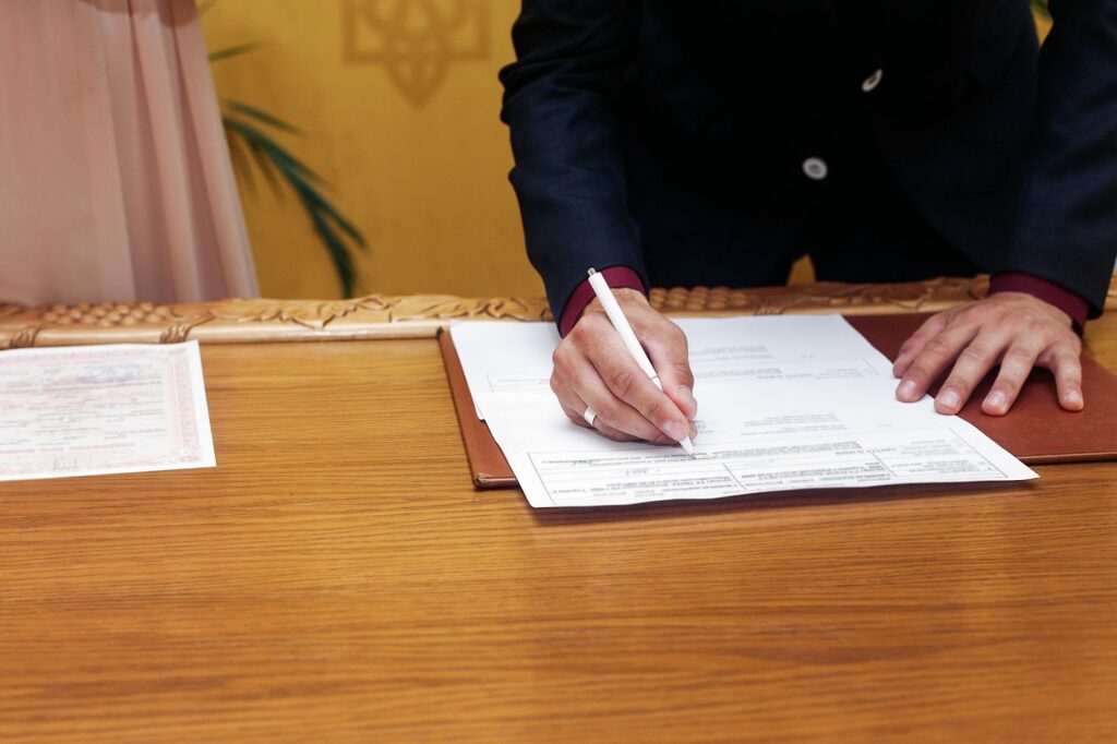 signing a document in order