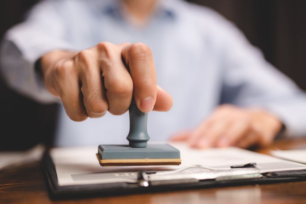 Notary using a stamp