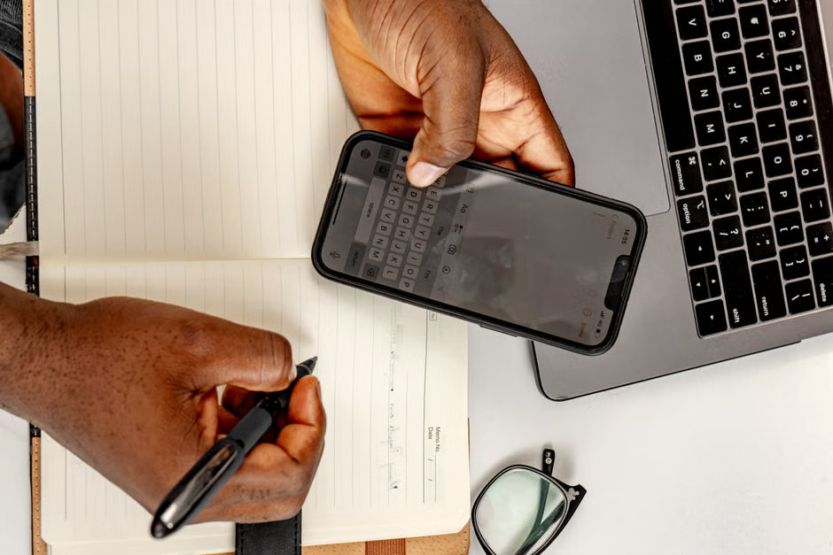 Notary Public using a digital notary journal app on a smartphone for secure record-keeping