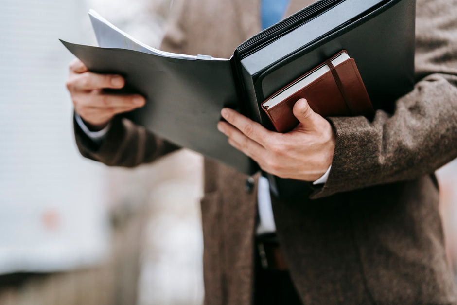 Notary reviewing journal entries to avoid common notary journal mistakes and improve record-keeping accuracy