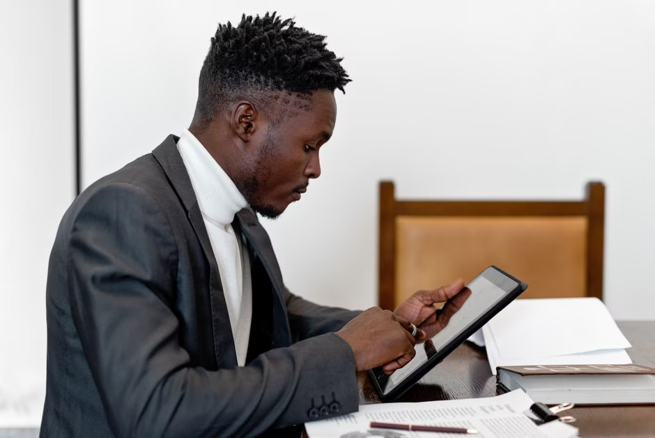 Professional Notary Public using the Notary Journal App on a smartphone to securely record a digital transaction.
